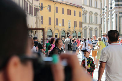 High angle view of people standing in city
