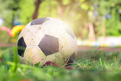 Close-up of soccer ball on field