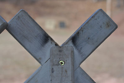 Close-up of cross against blurred background