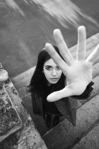 High angle portrait of woman standing on floor