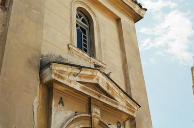 Low angle view of old building against sky