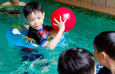 Boy playing in swimming pool