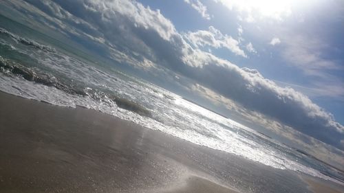 Scenic view of beach against sky