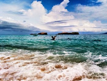 Scenic view of sea against cloudy sky