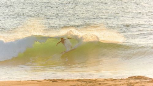 Man surfing in sea