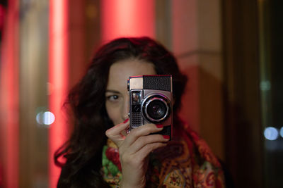 Portrait of woman photographing