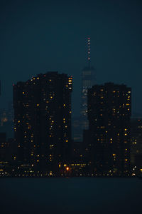 Illuminated buildings in city at night