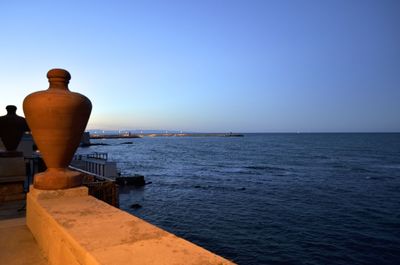 Scenic view of sea against clear blue sky