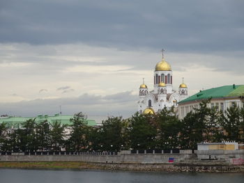 View of building against sky with trees in background