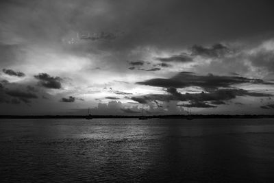 Scenic view of sea against sky at dusk