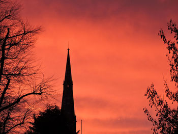 Low angle view of silhouette church against sky during sunset