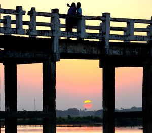 Built structure against sky at sunset