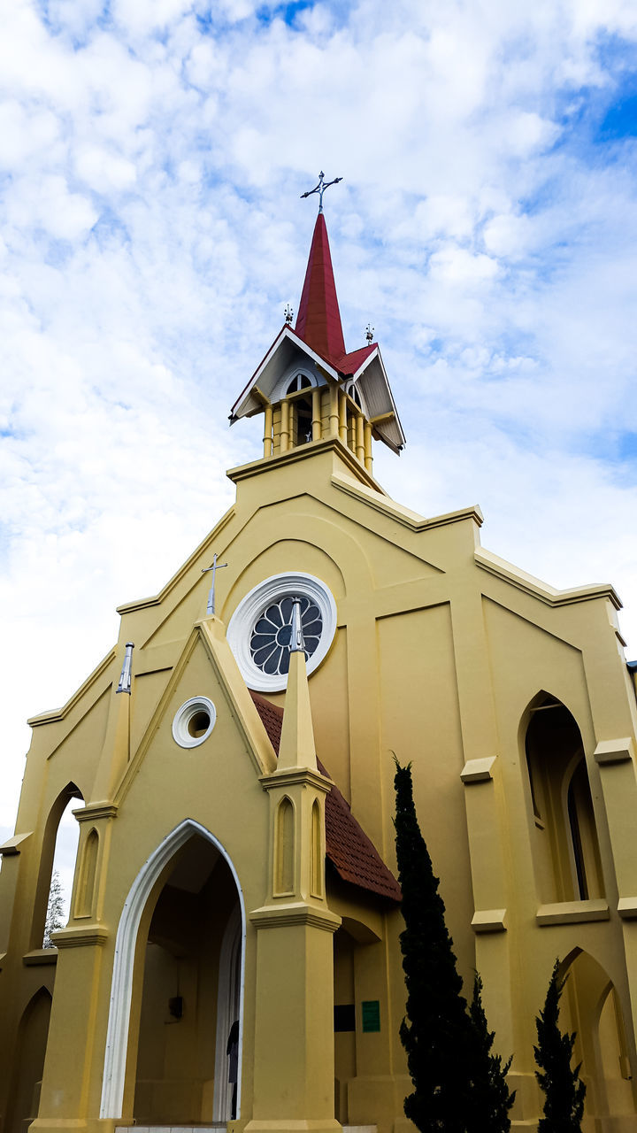 LOW ANGLE VIEW OF CLOCK TOWER BY BUILDING AGAINST SKY