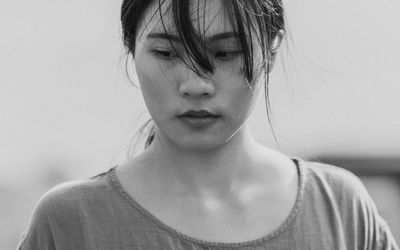 Close-up portrait of a smiling young woman