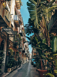 Narrow street amidst buildings against sky