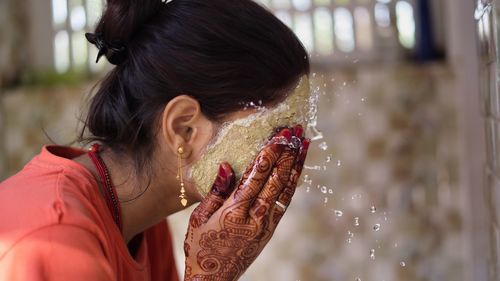Close-up of young woman looking away