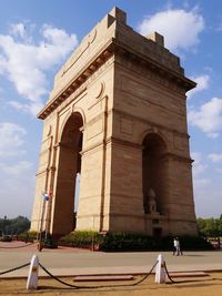 Low angle view of historical building against cloudy sky