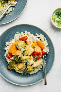 Paleo sweet and sour chicken over cauliflower rice flatlay