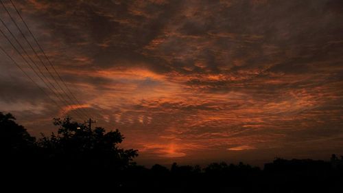 Silhouette of trees against sky during sunset