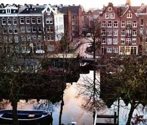 Canal amidst buildings in city