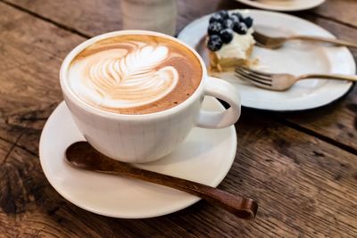 Close-up of cappuccino on table