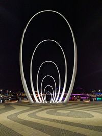 Illuminated light against sky at night