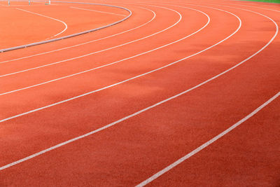 Full frame shot of orange track and field