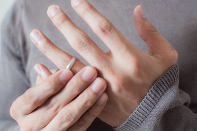 Close-up of couple holding hands