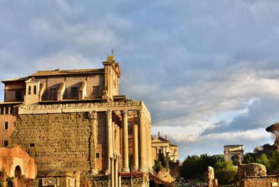 View of old building against cloudy sky