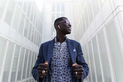 Low angle view of young man looking away