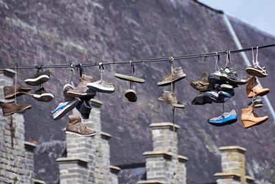 Low angle view of clothes drying against building