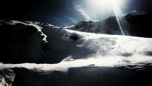 Scenic view of snowcapped mountains against sky