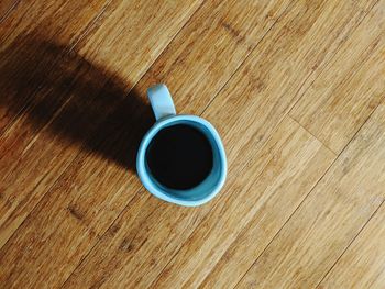 High angle view of coffee cup on table