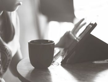 Close-up of coffee cup on table