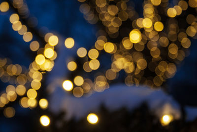 Defocused image of illuminated lights at night