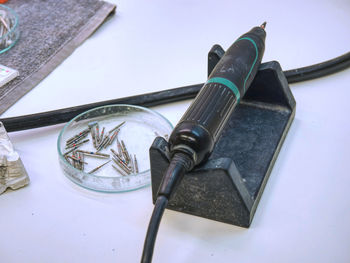 High angle view of old machine on table