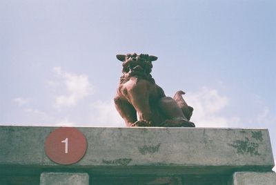 Low angle view of a dog against the sky