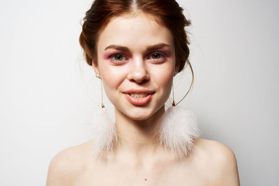 Portrait of a beautiful young woman over white background