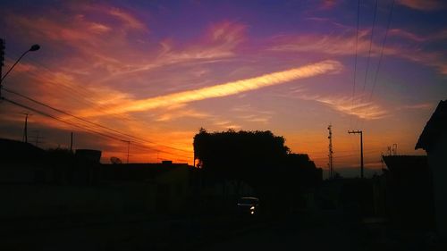 Silhouette of city at sunset