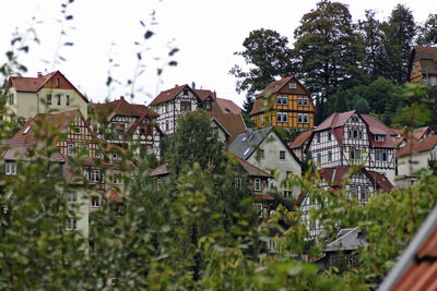 Buildings in town against sky