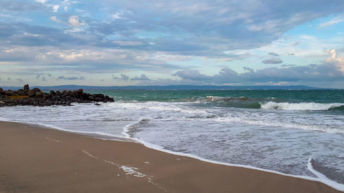 Scenic view of beach against sky