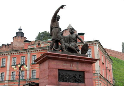 Low angle view of statue against sky