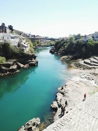 High angle view of river amidst rocks against sky