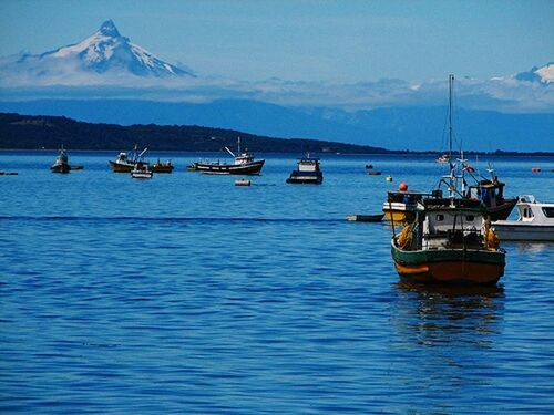 nautical vessel, mountain, water, transportation, boat, mode of transport, sky, sea, waterfront, mountain range, scenics, tranquil scene, tranquility, beauty in nature, nature, moored, rippled, travel, blue, cloud - sky