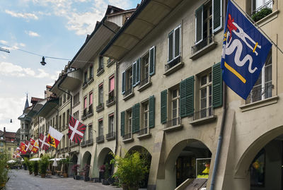 Low angle view of buildings in city against sky