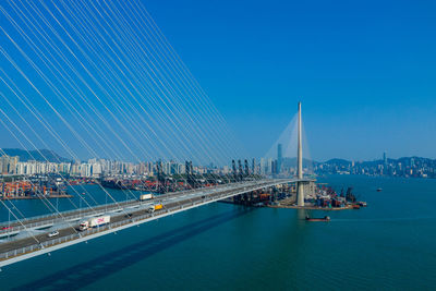 View of bridge over sea against blue sky