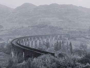 Viaduct against mountains