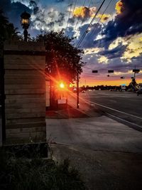 View of street against sky during sunset