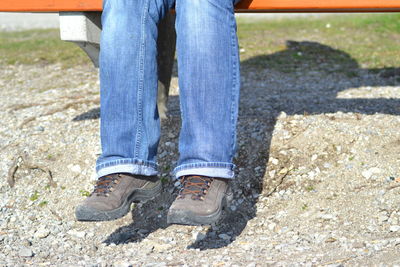 Low section of man standing on ground