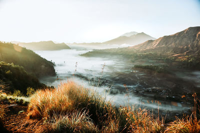Scenic view of lake and mountains against sky